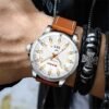 Man wearing CURREN 8376 men’s casual analog leather strap watch