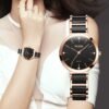 Woman wearing Olevs 5877 elegant quartz watch with black stainless steel